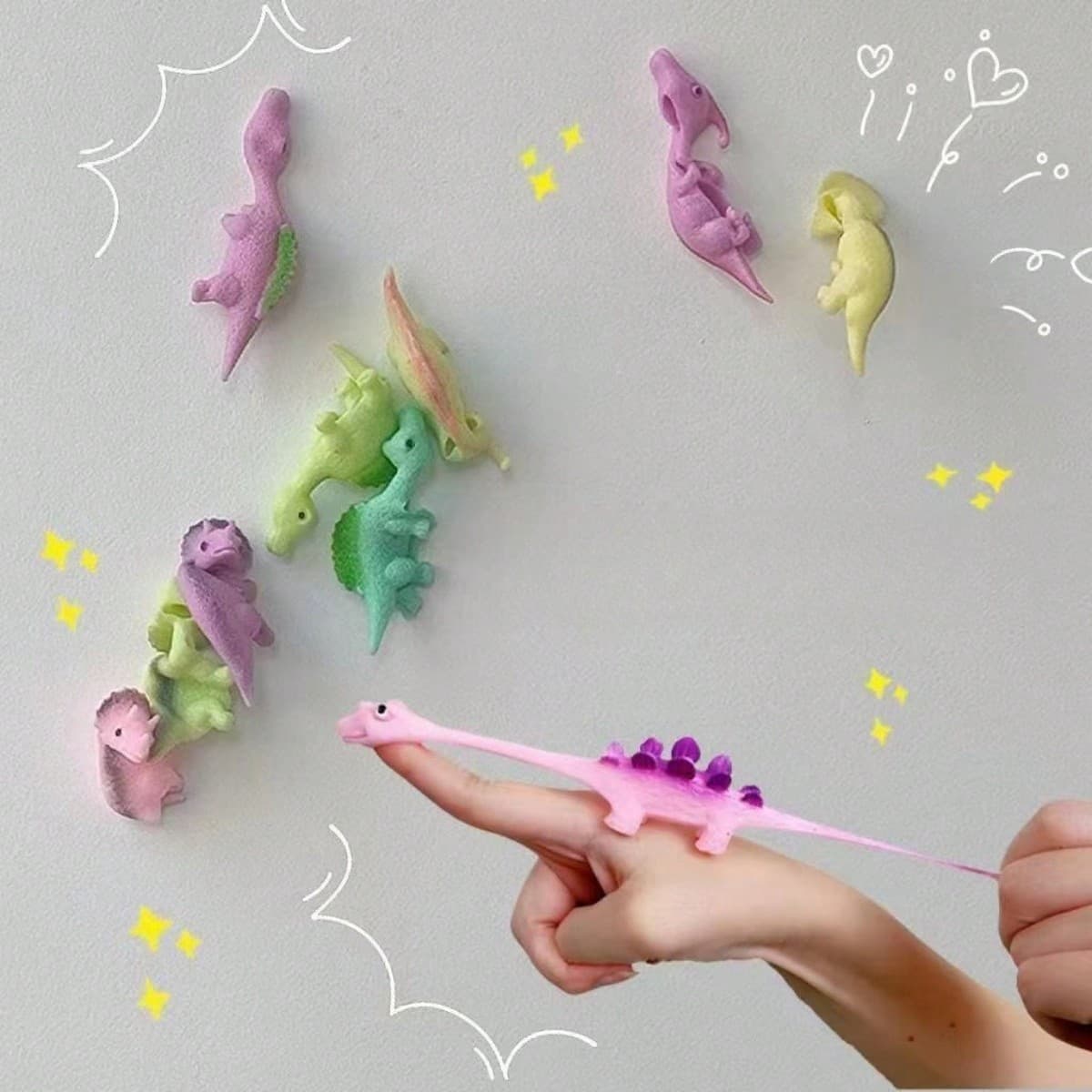 1 pièce Jouet amusant de lancement de dinosaure à doigt, jouet créatif en caoutchouc souple anti-stress (couleur aléatoire), jouet de piscine